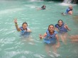 Visitors swimming in Blue Hole